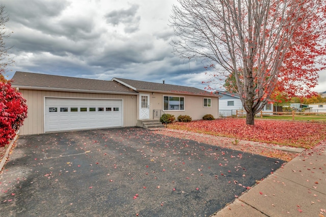 single story home with a garage