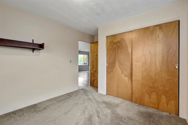 empty room with light colored carpet