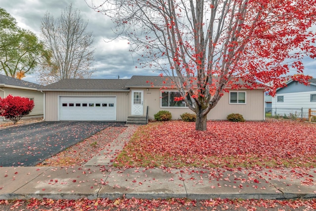 ranch-style home featuring a garage