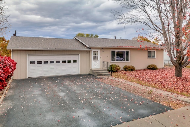 ranch-style home featuring a garage