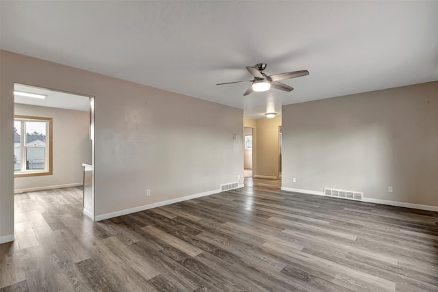 unfurnished room with wood-type flooring and ceiling fan