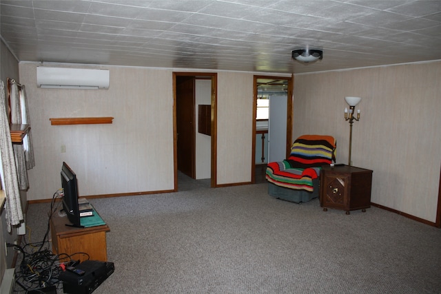 sitting room with carpet floors and an AC wall unit