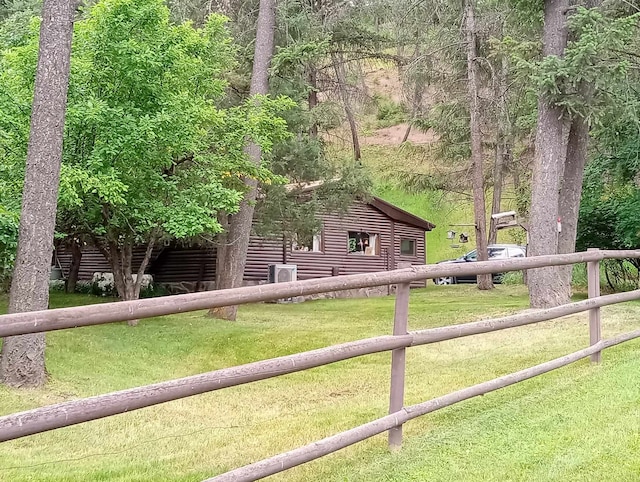 view of side of home featuring a yard