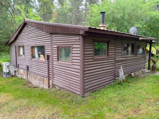 view of side of property with a yard