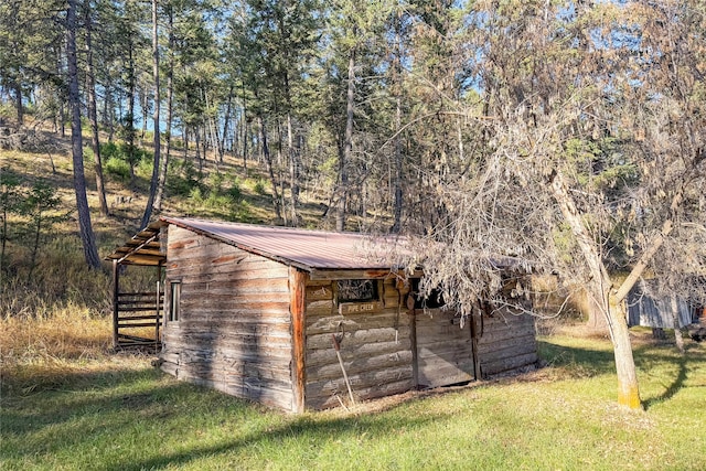 view of outdoor structure with a yard