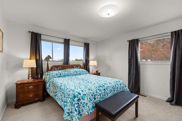 bedroom featuring light colored carpet