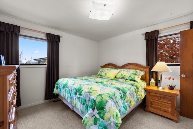 bedroom featuring light carpet