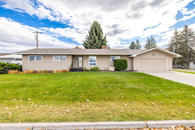 ranch-style home featuring a garage and a front lawn