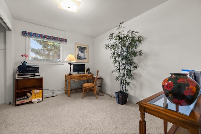 office area featuring lofted ceiling and carpet flooring