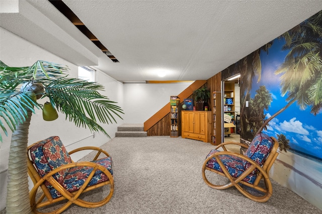 living area featuring a textured ceiling and carpet floors