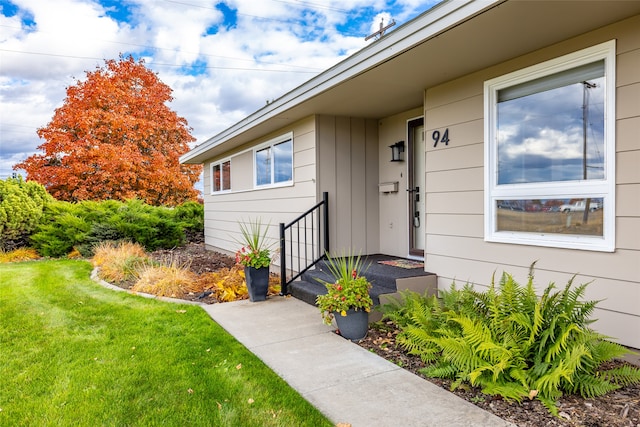 entrance to property with a yard