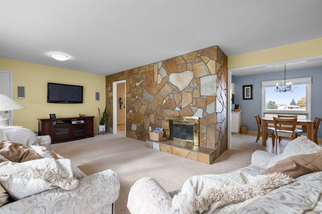 living room featuring a fireplace, a chandelier, and light colored carpet