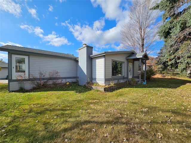 view of property exterior with a yard