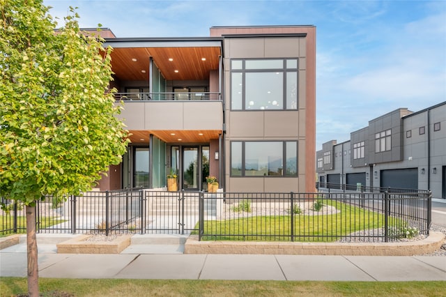 contemporary home with a balcony and a garage