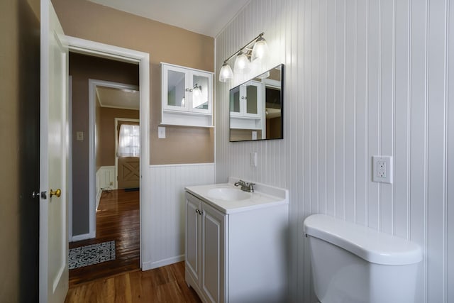 bathroom with vanity, hardwood / wood-style floors, and toilet