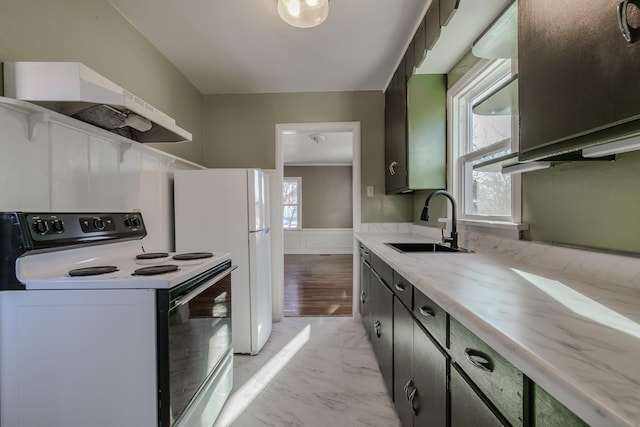 kitchen featuring white appliances, a healthy amount of sunlight, sink, and butcher block countertops