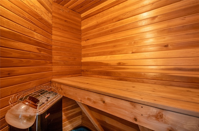 view of sauna / steam room featuring wooden walls