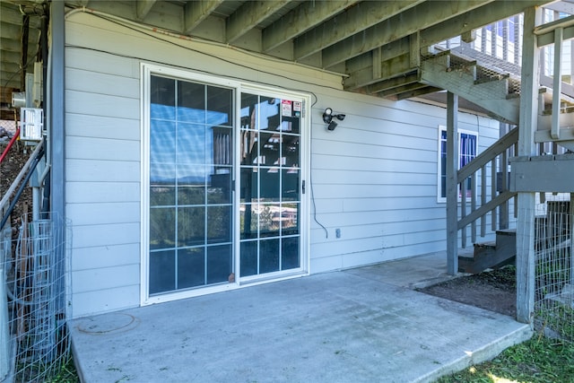 entrance to property featuring a patio area