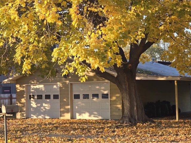 view of side of home with an outbuilding and a garage