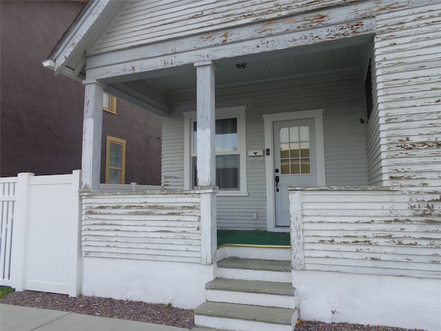 doorway to property with a porch