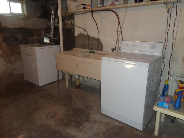 interior space with sink and washing machine and clothes dryer