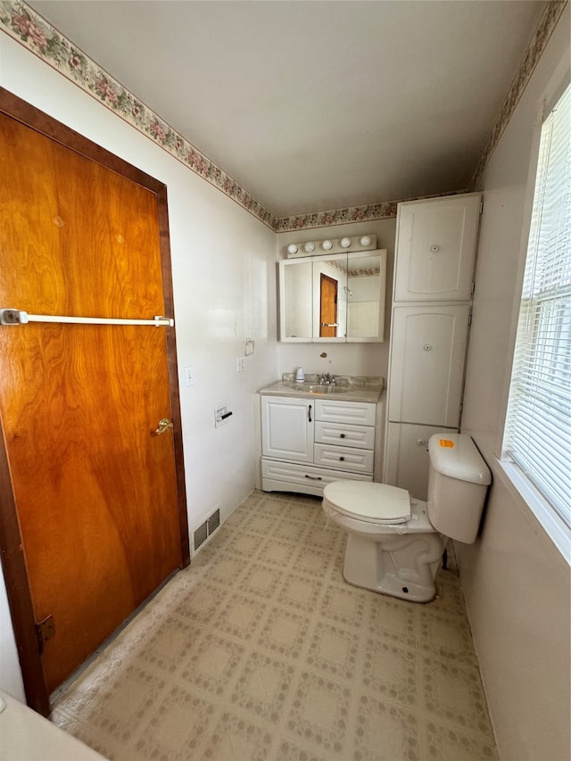 bathroom with vanity and toilet