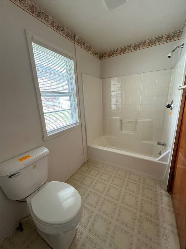 bathroom featuring toilet and shower / bathtub combination