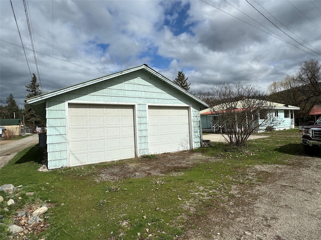 garage featuring a yard