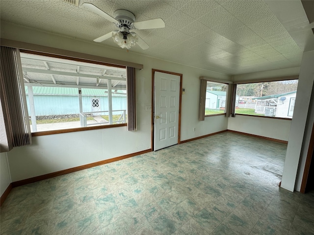 interior space featuring a healthy amount of sunlight and ceiling fan