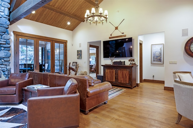 living room with light hardwood / wood-style flooring, a chandelier, beamed ceiling, and wooden ceiling