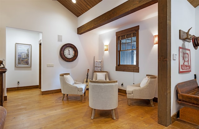 sitting room featuring light hardwood / wood-style flooring and wooden ceiling