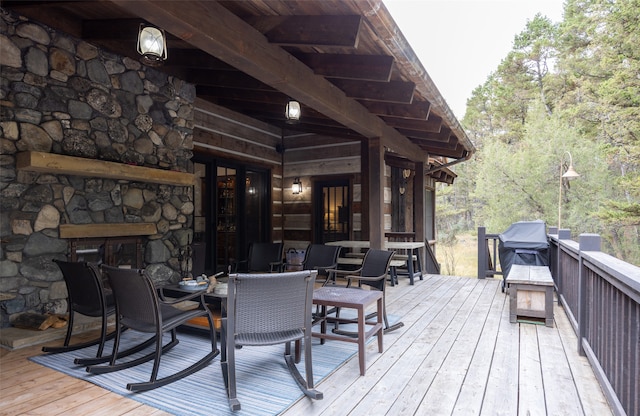 wooden terrace with a grill