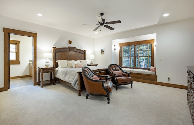 carpeted bedroom featuring multiple windows and ceiling fan