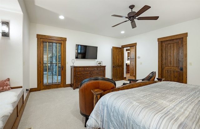 bedroom featuring light colored carpet and ceiling fan