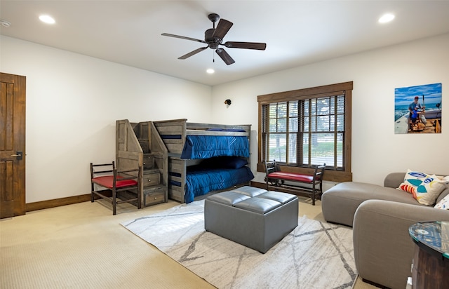 living room with light carpet and ceiling fan