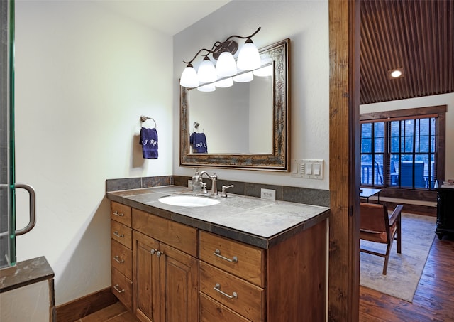 bathroom featuring vanity and wood-type flooring