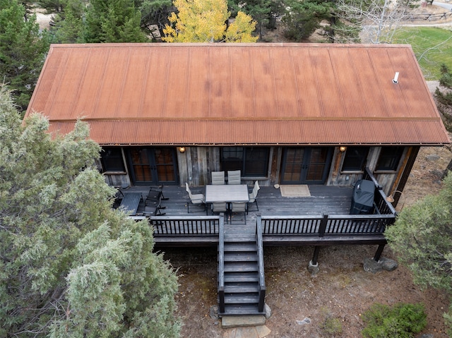 back of house featuring a wooden deck