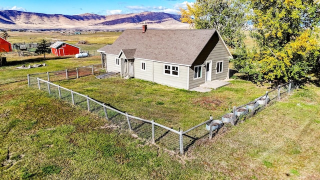 birds eye view of property with a rural view and a mountain view