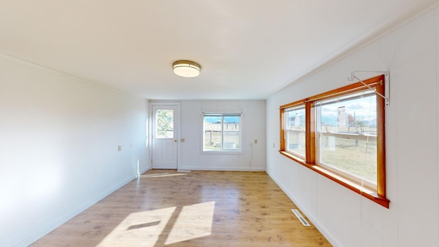 doorway to outside with light hardwood / wood-style floors