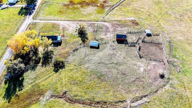 birds eye view of property featuring a rural view