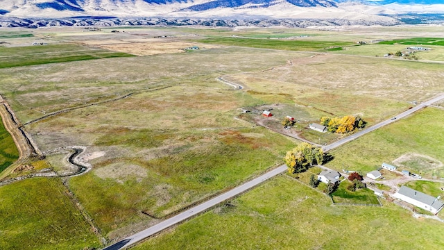 drone / aerial view with a mountain view and a rural view