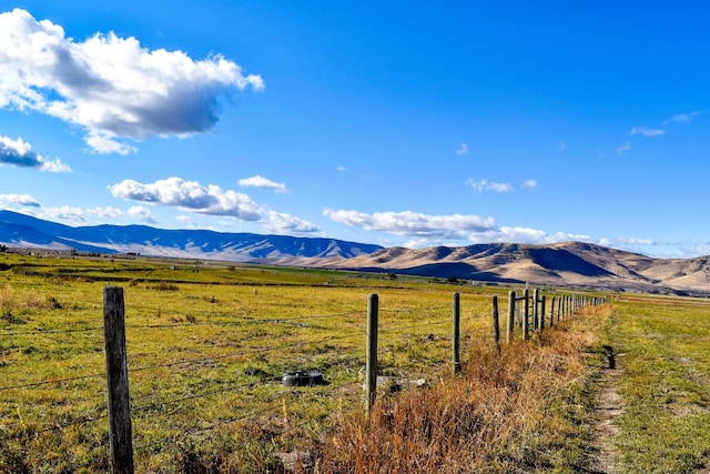 mountain view featuring a rural view