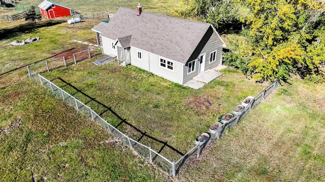 birds eye view of property with a rural view