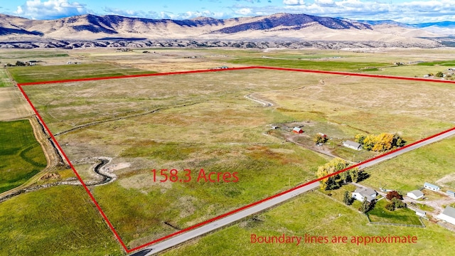 aerial view featuring a rural view and a mountain view