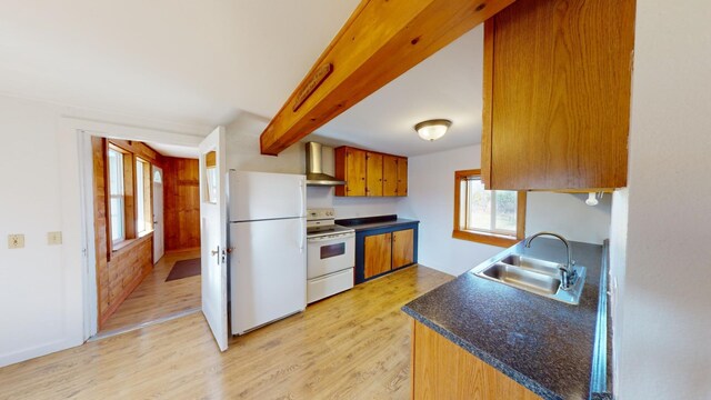 kitchen featuring light hardwood / wood-style floors, sink, wall chimney range hood, and white appliances