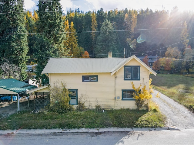 view of home's exterior featuring a carport