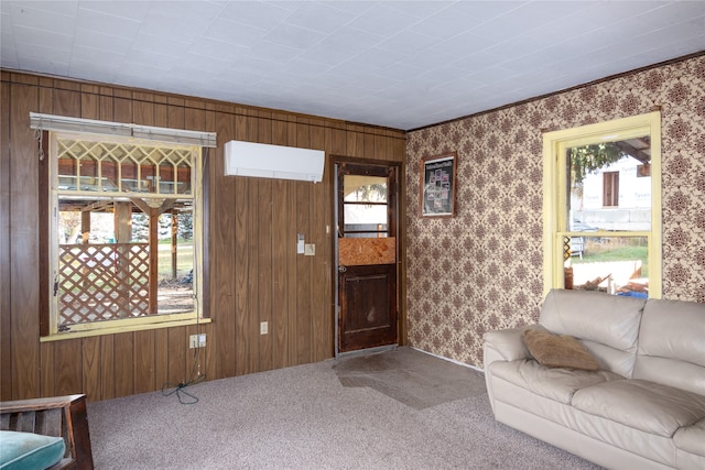 foyer entrance with an AC wall unit, carpet, and wooden walls