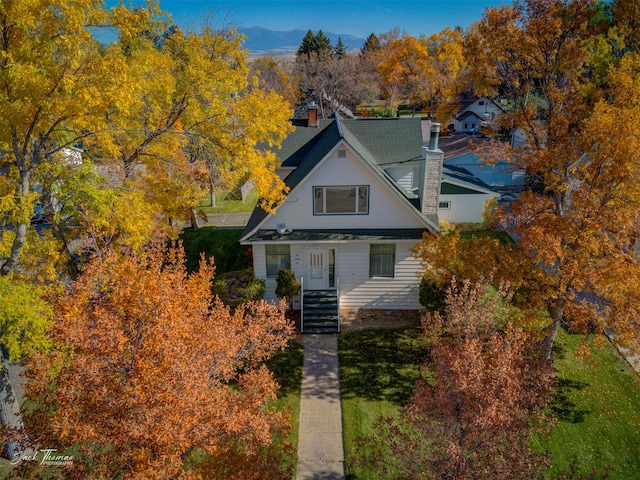 view of front of home with a mountain view and a porch