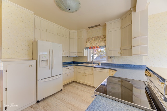 kitchen with sink and white appliances