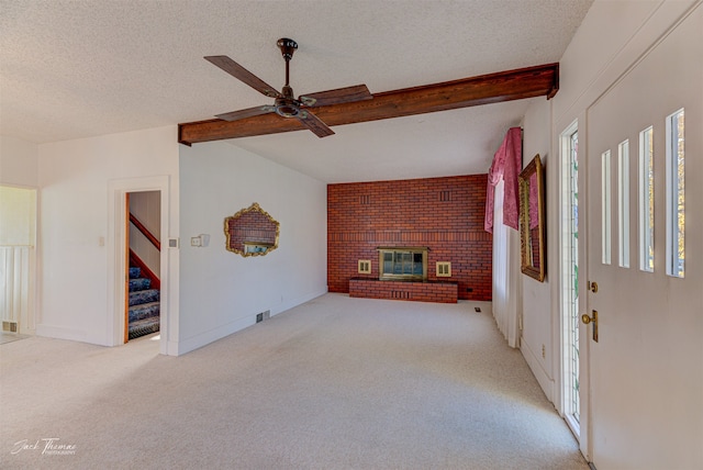 unfurnished living room featuring light carpet, a fireplace, and ceiling fan